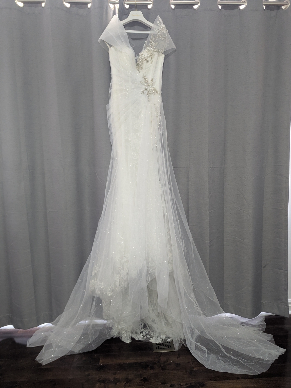 White Mermaid Style Wedding Dress With Heavy Detailing